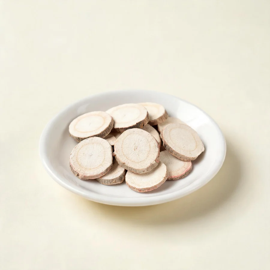 Dried Bai Shao root arranged in a shallow bowl