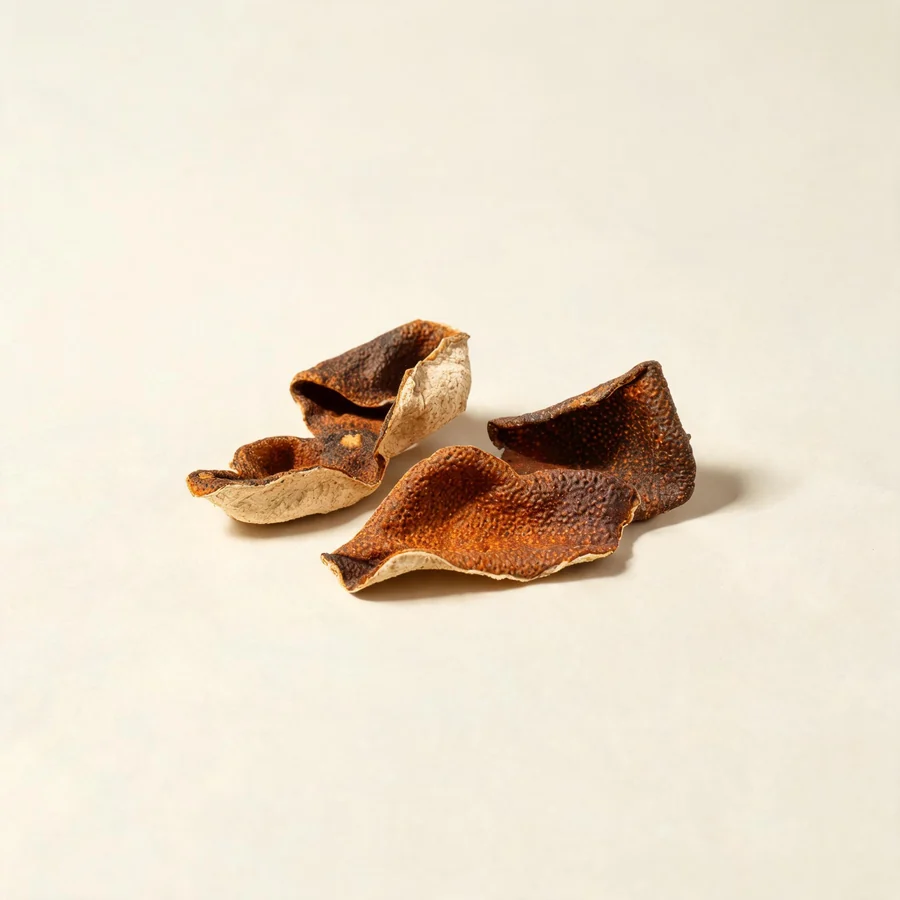 Dried Chen Pi peel arranged in a shallow bowl