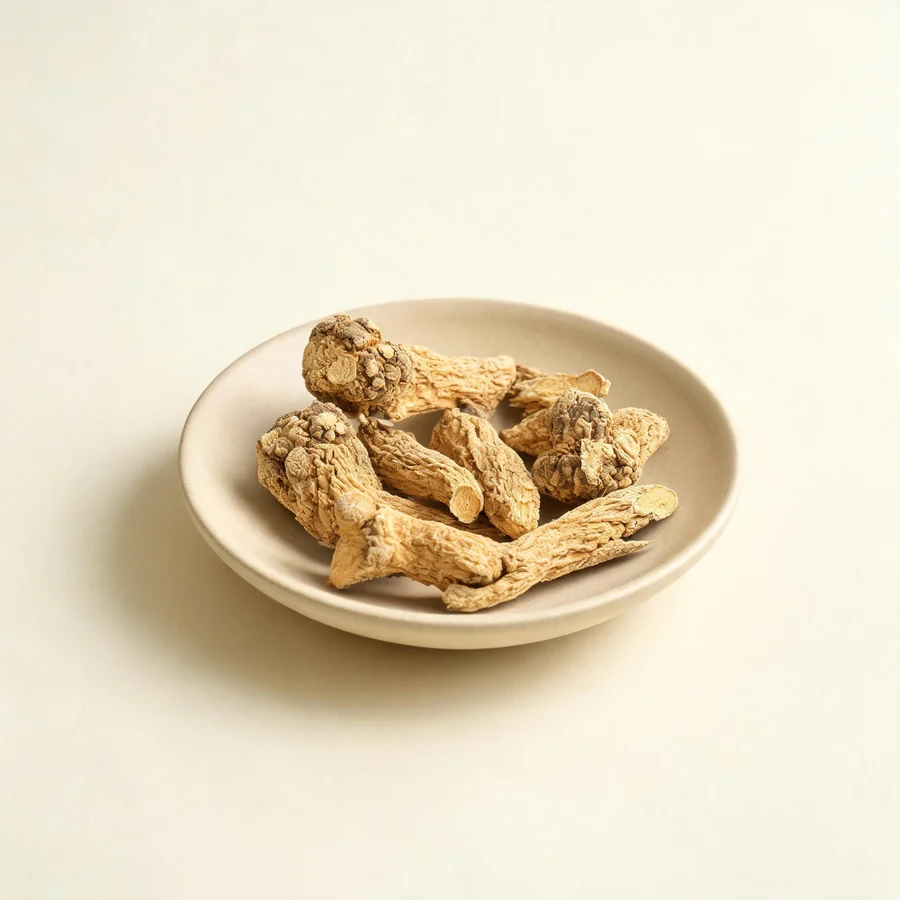Dried Fang Feng root arranged in a shallow bowl