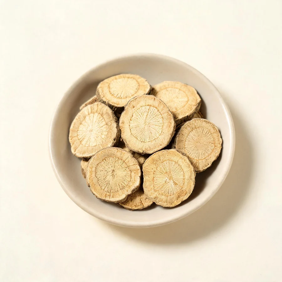 Dried Fang Ji dried root arranged in a shallow bowl