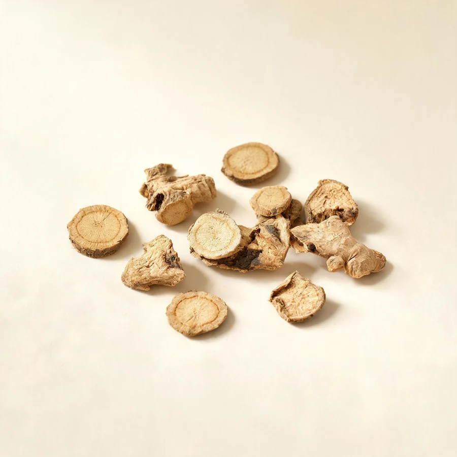 Dried Gan Jiang rhizome arranged in a shallow bowl