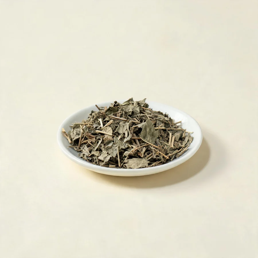 Dried Huo Xiang aerial parts arranged in a shallow bowl
