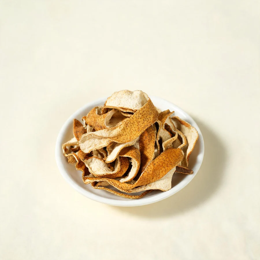Dried Li Pi fruit peel arranged in a shallow bowl