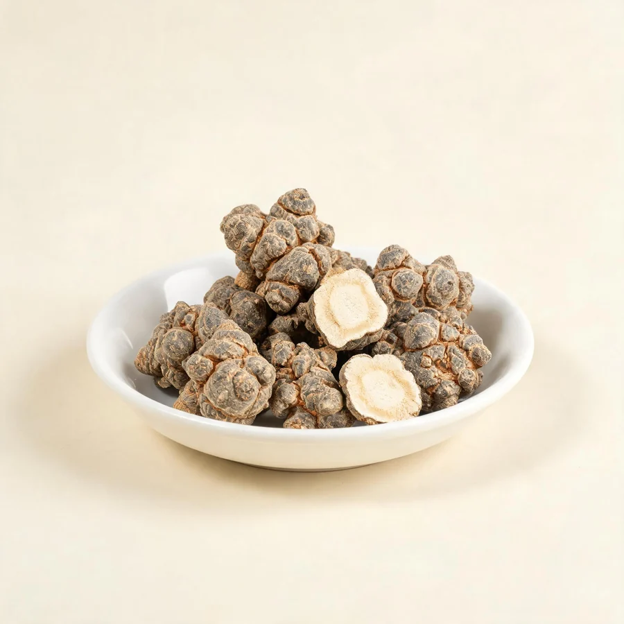 Dried San Qi root arranged in a shallow bowl