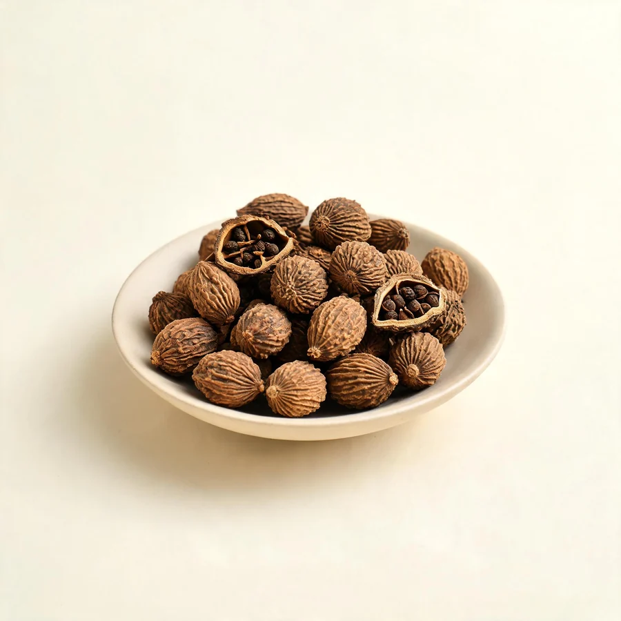 Dried Sha Ren fruit arranged in a shallow bowl